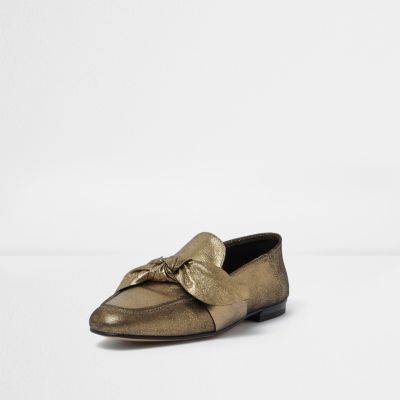 Gold leather bow front loafers